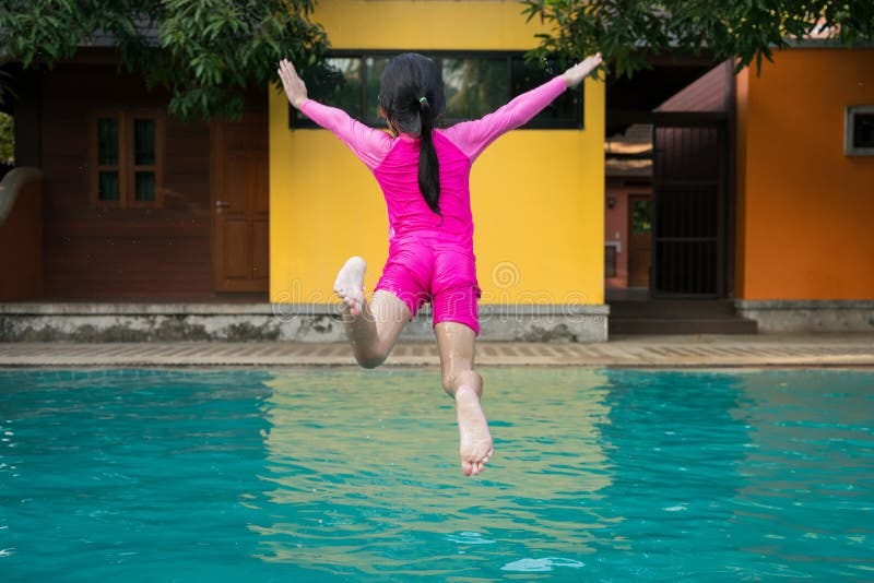 Little Girl Jumping in Swimming Pool. Stock Image - Image of kids,  vacation: 93926055