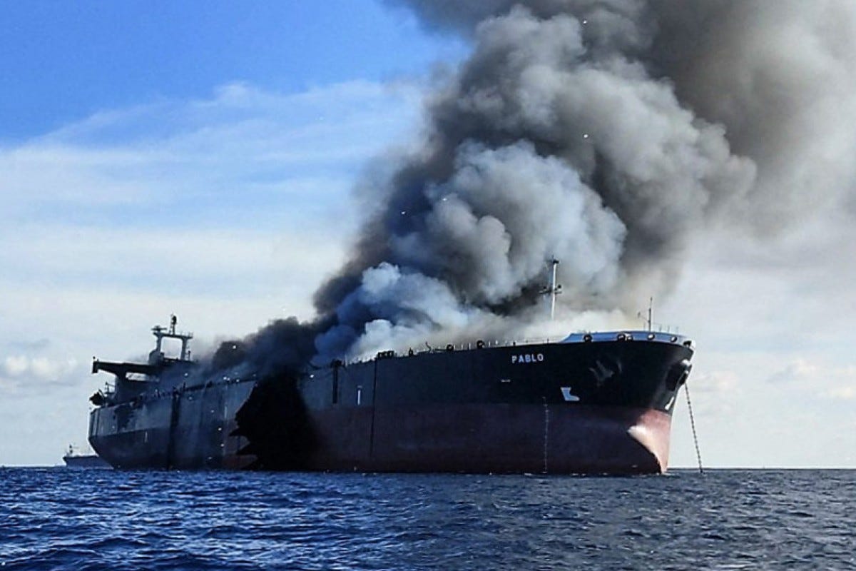 Burning oil tanker Pablo, thick black billowing smoke Burning oil tanker Pablo, thick black billowing smoke