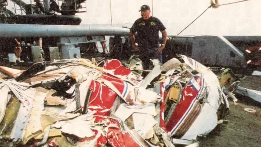Man stands next to wreckage of JFK Jr.'s plane Man stands next to wreckage of JFK Jr.'s plane