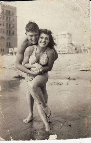 A charming snapshot of a young couple enjoying a day at the beach in 1931.