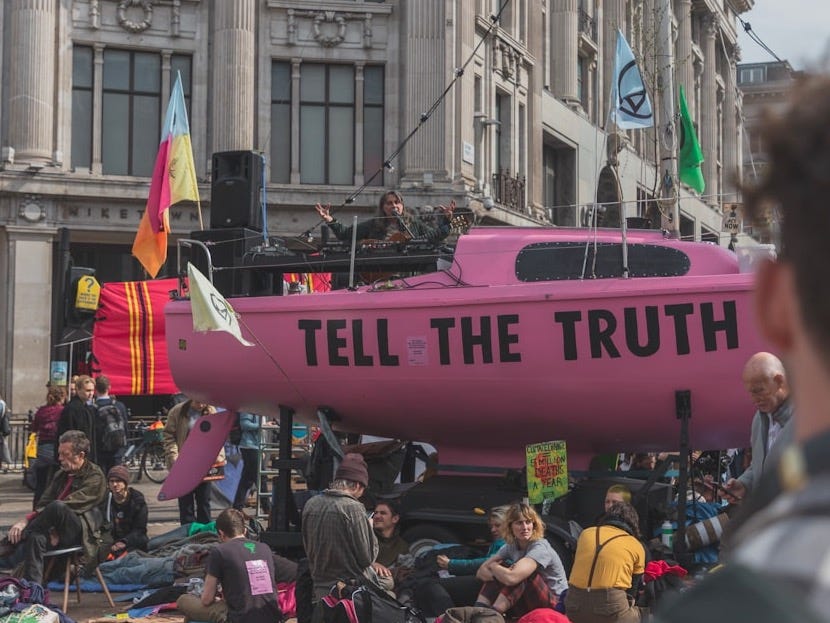 people having rally in the middle of road