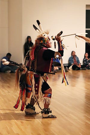 White Horses dancer performing a Powwow demo.