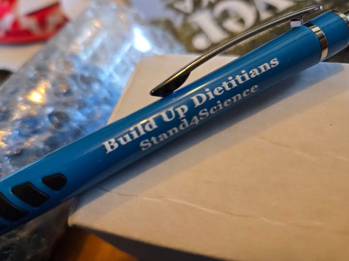 May be an image of text that says 'Dietitians Dietitians Science BuildUp त Up Stand'