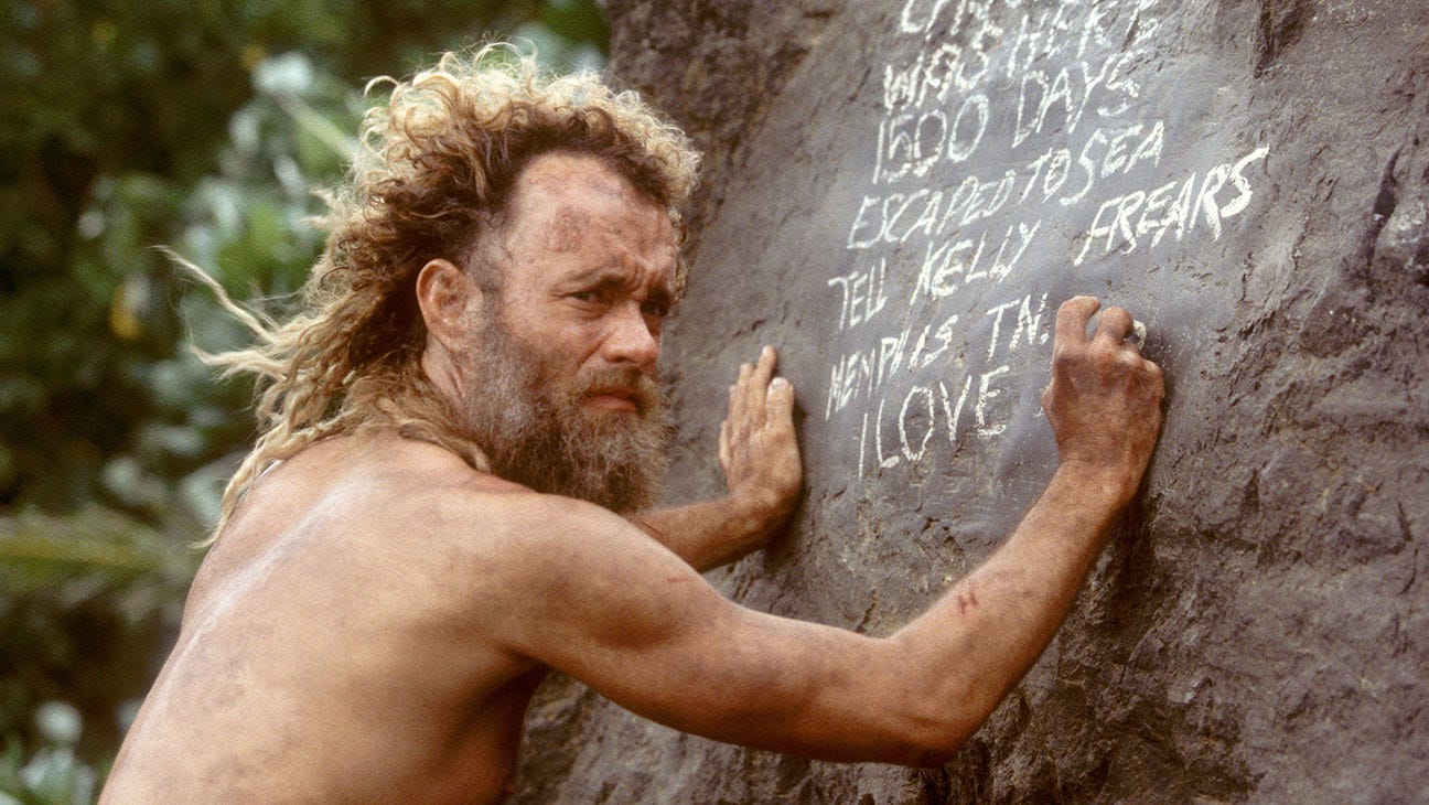 Cast Away Wilson image: "Tom Hanks as Chuck Noland with Wilson the volleyball in Cast Away, illustrating human tendency to anthropomorphize inanimate objects