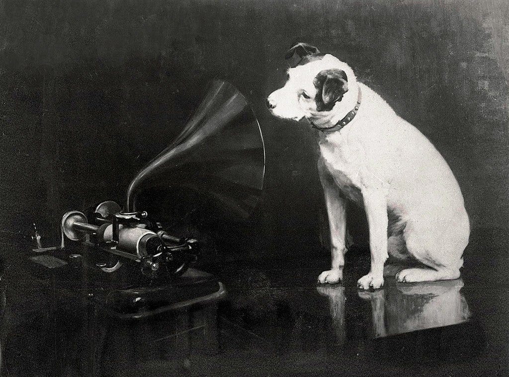 Francis Barraud’s 1898 painting of Nipper looking into an Edison Bell cylinder phonograph Francis Barraud’s 1898 painting of Nipper looking into an Edison Bell cylinder phonograph