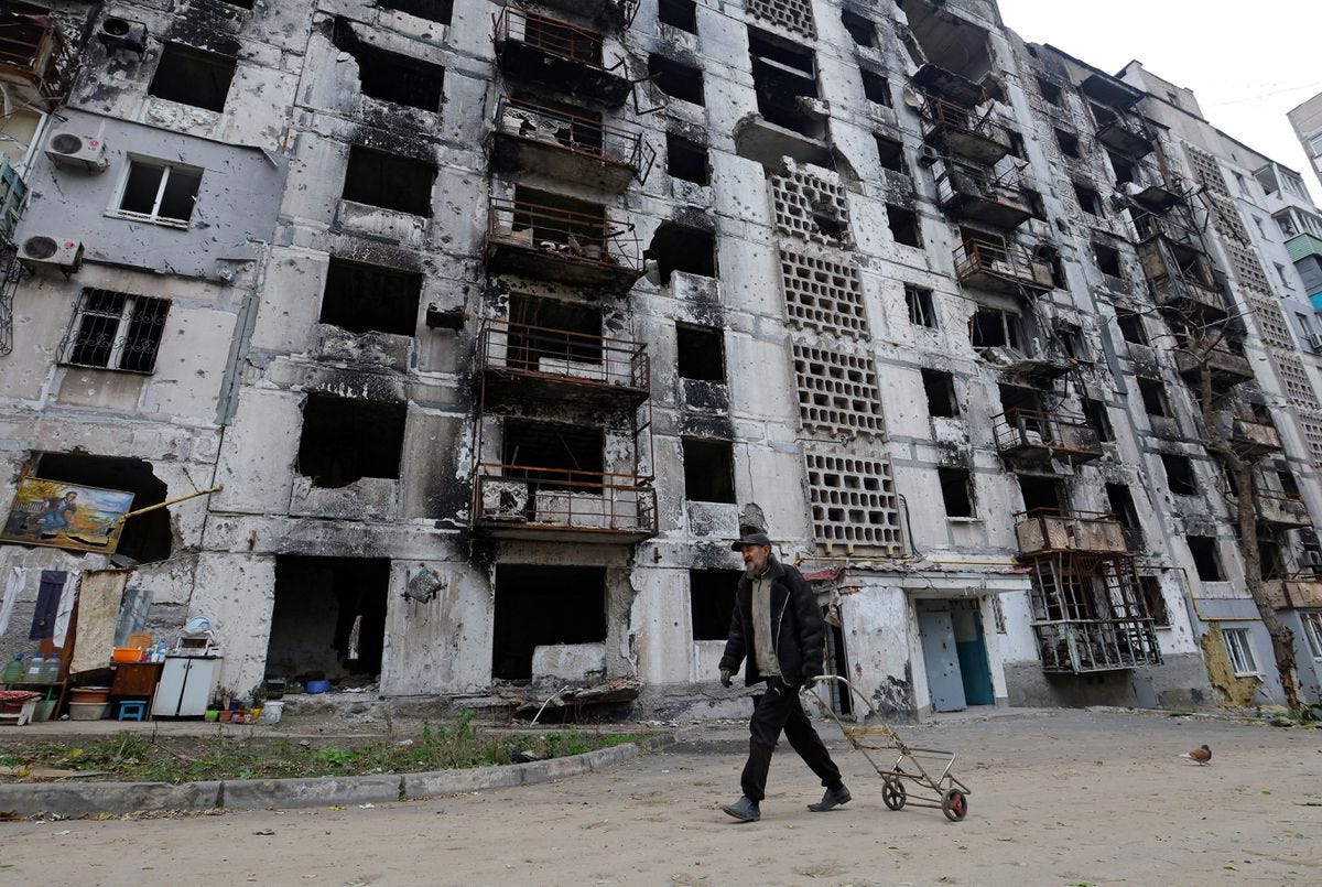 A man walks past an apartment building heavily damaged in the Russia-Ukraine conflict, in Mariupol, Ukraine, November 16, 2022. /Reuters A man walks past an apartment building heavily damaged in the Russia-Ukraine conflict, in Mariupol, Ukraine, November 16, 2022. /Reuters