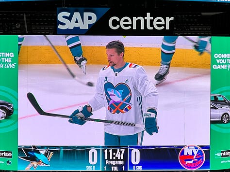 Images of a hockey rink, a hockey pride logo, three hockey players wearing the pride logo jersey