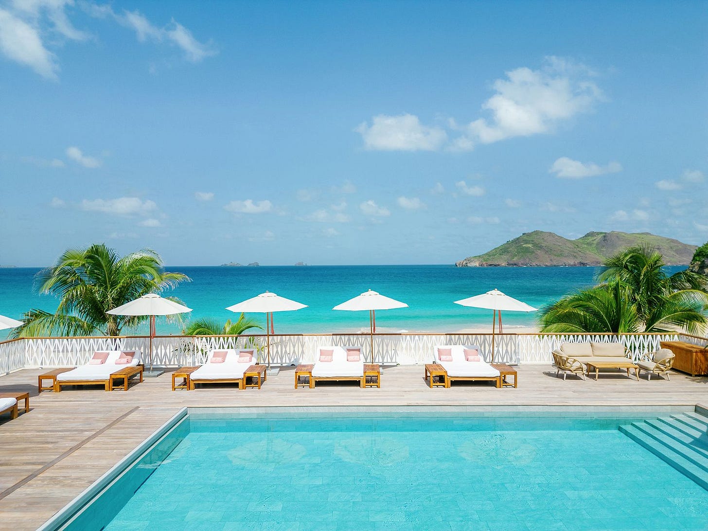 Image may contain Summer Chair Furniture Outdoors Pool Water Nature Tropical Swimming Pool Sea and Land Image may contain Summer Chair Furniture Outdoors Pool Water Nature Tropical Swimming Pool Sea and Land