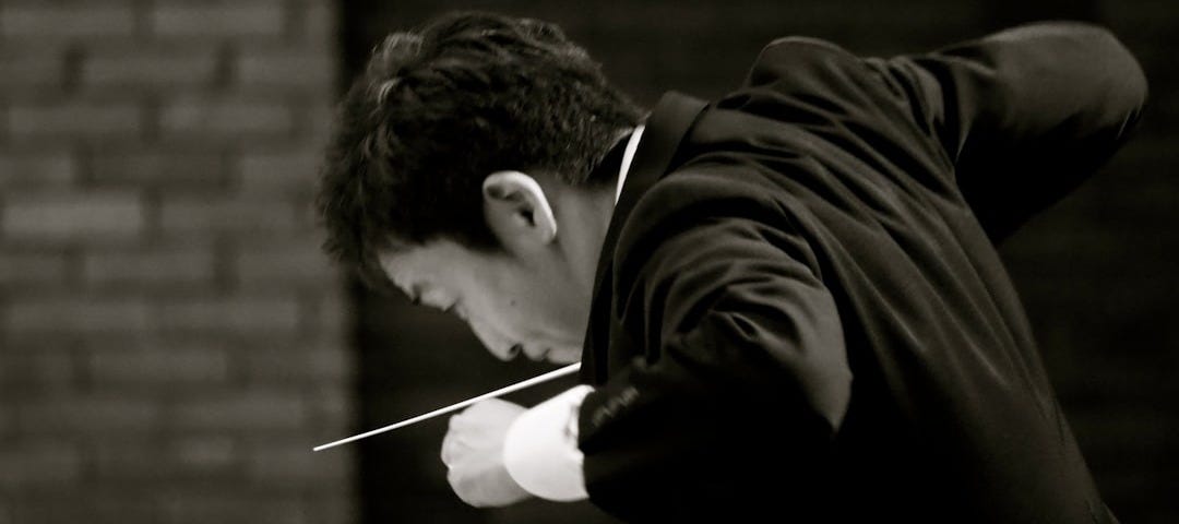 man in black long sleeve shirt holding girl in black long sleeve shirt