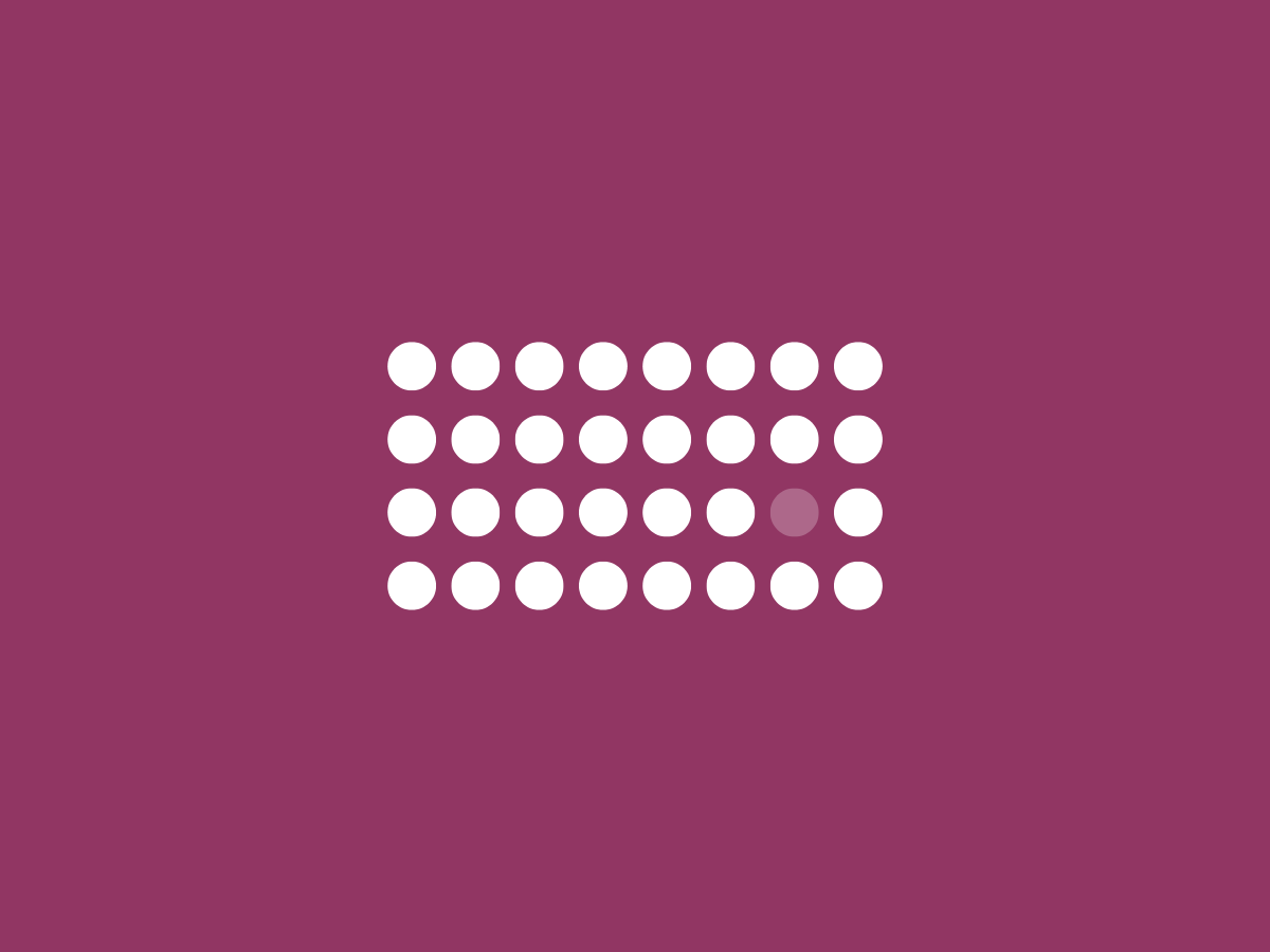 maroon background with white set of dots in the middle