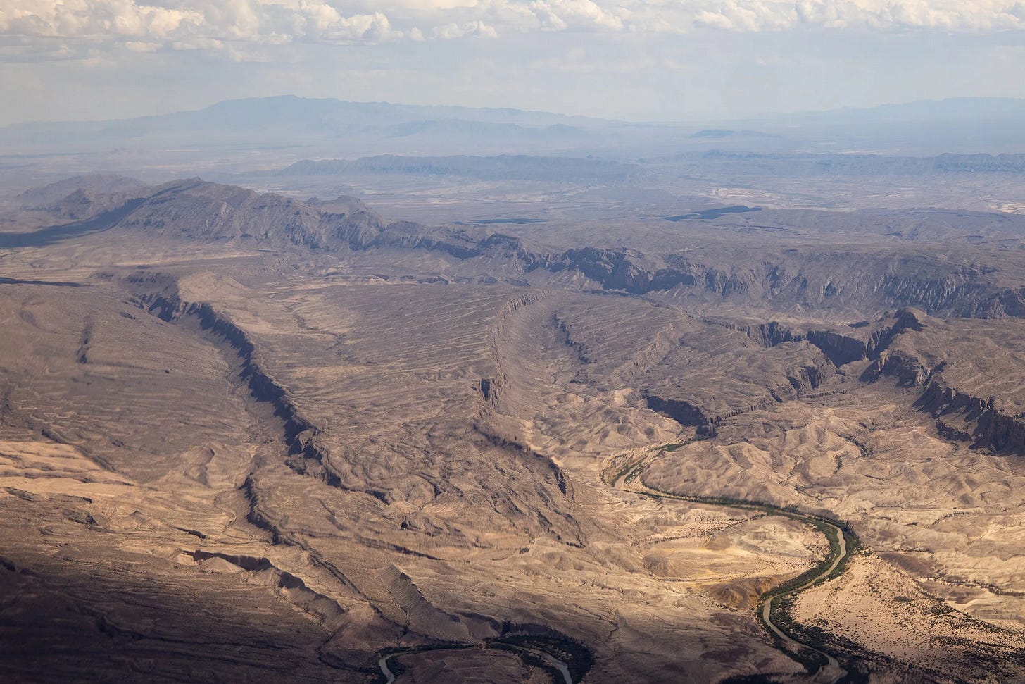 The Rio Grande cuts through the desert between the United States and Mexico as seen from an aerial view over Big Bend National Park on May 24, 2026.(Photo by Kaylee Greenlee for The Texas Tribune) The Rio Grande cuts through the desert between the United States and Mexico as seen from an aerial view over Big Bend National Park on May 24, 2026.(Photo by Kaylee Greenlee for The Texas Tribune)