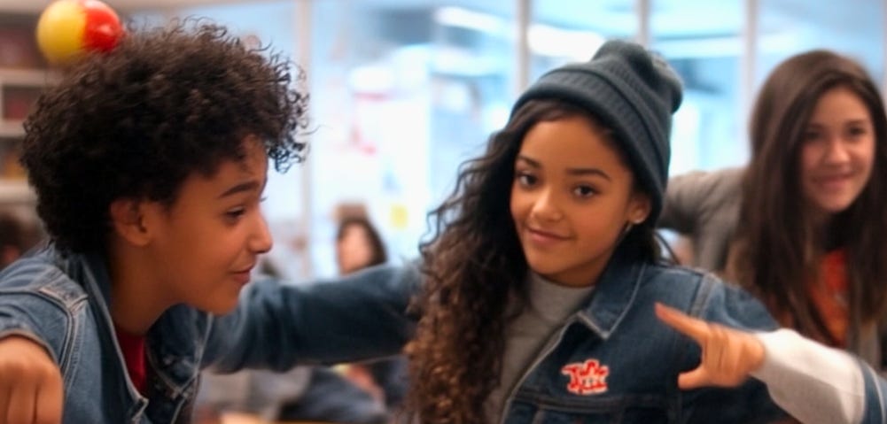 A group of middle school students participate in a classroom mannequin challenge. They are paused mid-motion, smiling and laughing, as part of a high-energy activity designed to build collaboration, engagement, and connection. The playful freeze-frame moment reflects how movement and creativity can strengthen classroom culture while keeping students focused and involved.