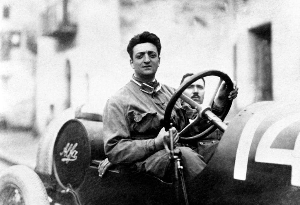Enzo Ferrari driving an Alfa Romeo