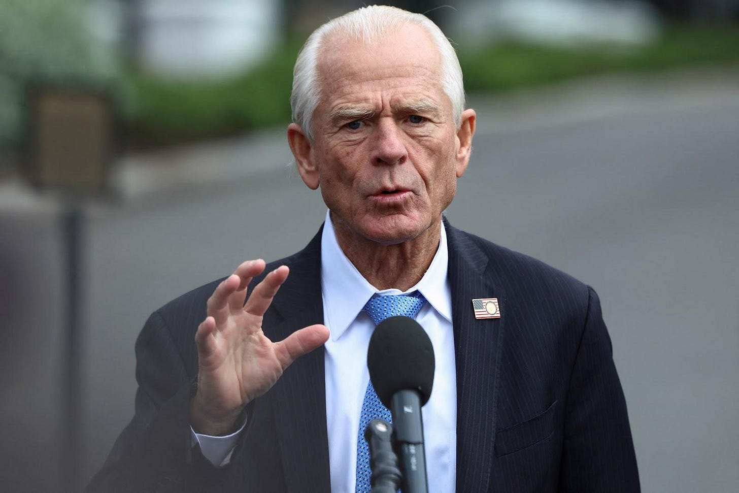 Peter Navarro speaks to the media outside the White House