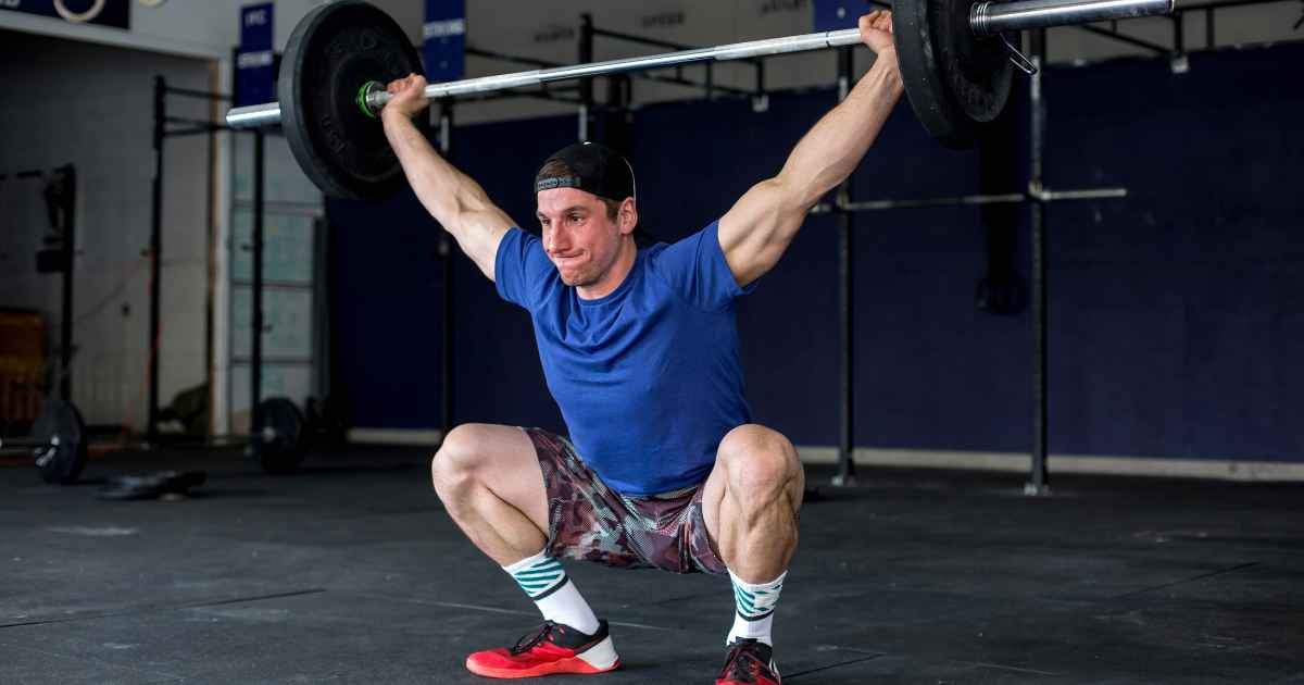 Young athlete performing an overhead squat