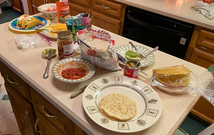 Warm your soft tacos, cook your beef and hard tacos then put it all together.