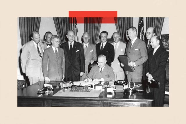 President Harry S. Truman (1884 - 1972) signing the North Atlantic Treaty which marked the beginning of NATO