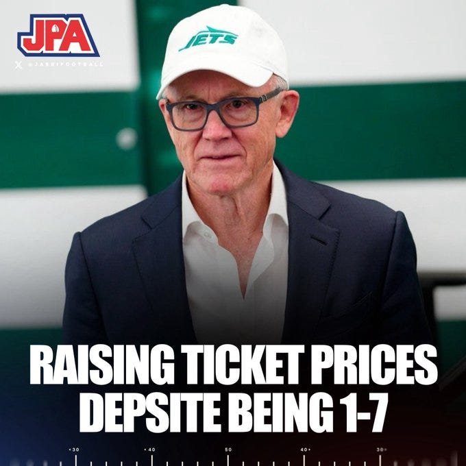 A man with glasses wearing a white New York Jets cap and a navy blue suit with white shirt sits in front of a green background. Overlaid text reads RAISING TICKET PRICES DESPITE BEING 1-7 with team logos including JPA and X Football.