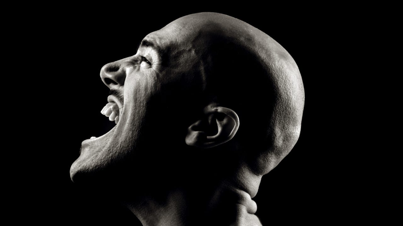 A man yelling in pain. A man yelling in pain.