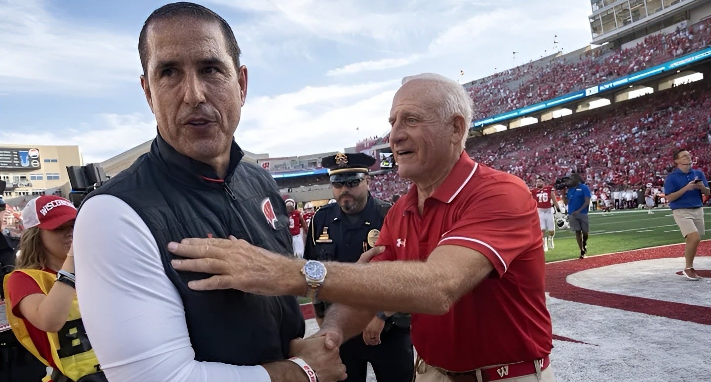 Wisconsin Badgers head football coach Luke Fickell and Ted Kellner shake hands after a game at Camp Randall Stadium.