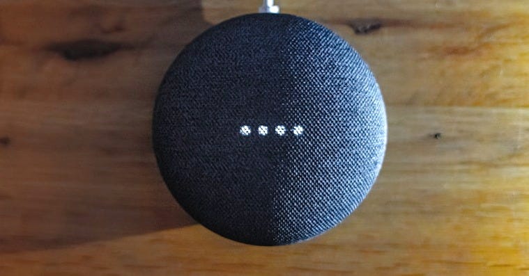 a blue ball on a wooden surface