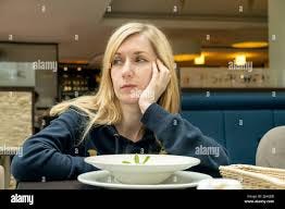Woman eating alone lonely cafe hi-res ...