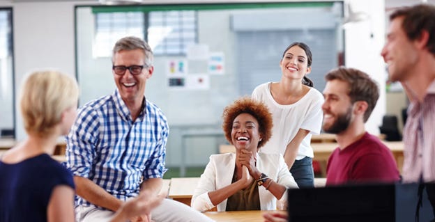 A group of people laughing

AI-generated content may be incorrect.