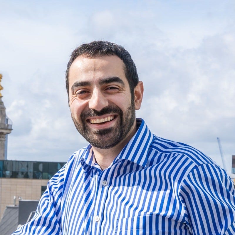 professional man with a blue and white striped shirt
