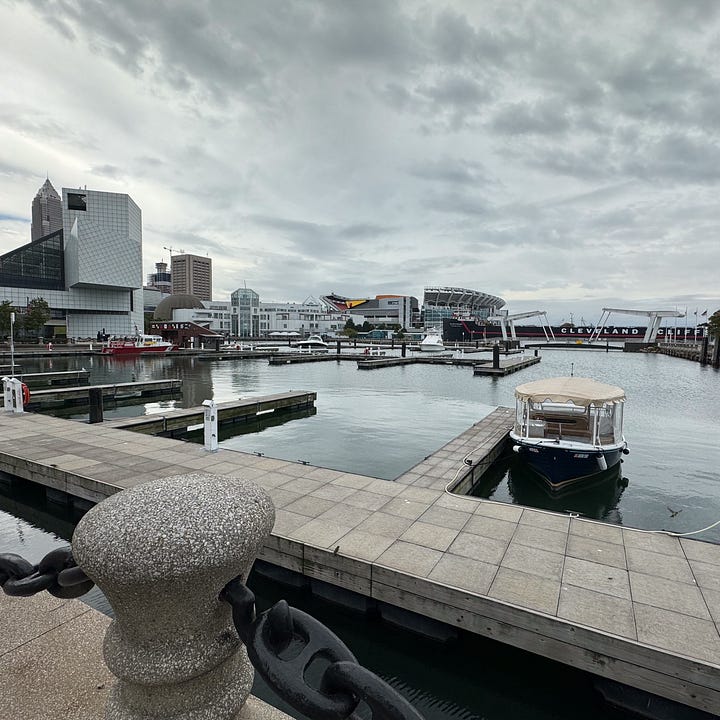Photos of a harbor in Cleveland, downtown Chicago, Mt. Rushmore and Omaha, NE