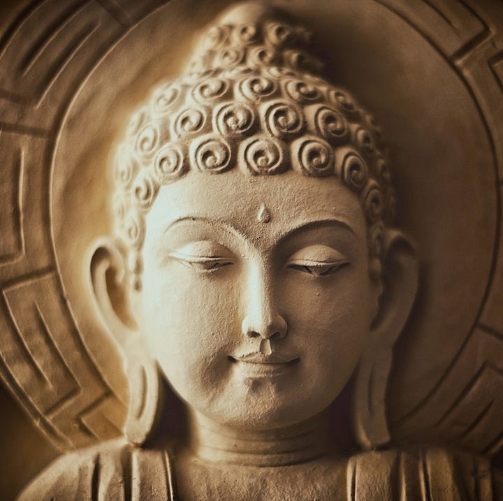 Photographs from a statue of Aristotle and one of the Buddha