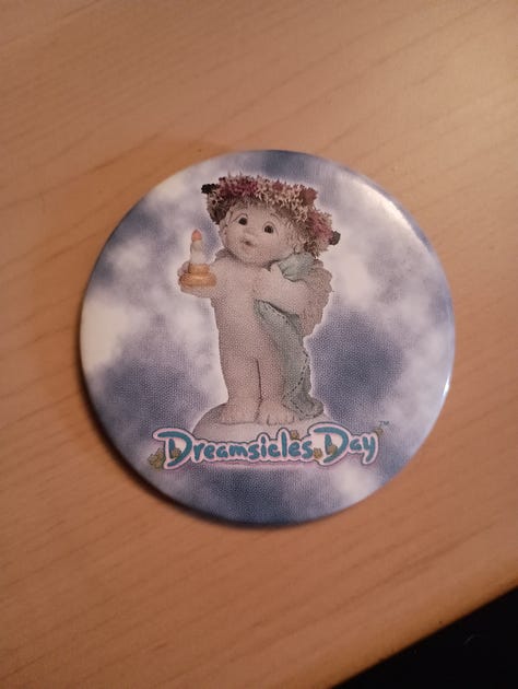 dreamsicles pin, resin flower basked, and a 22 three river festival pin