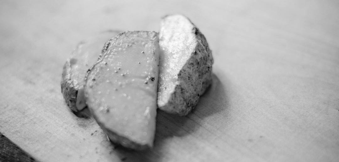 a piece of food on a wooden surface