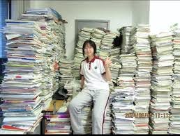 Photo of a Chinese girl with all the study materials her class had to go through to pass the Gaokao and get into university. My apologies for the previous confusion. #gaokao #chineseeducation # Photo of a Chinese girl with all the study materials her class had to go through to pass the Gaokao and get into university. My apologies for the previous confusion. #gaokao #chineseeducation #