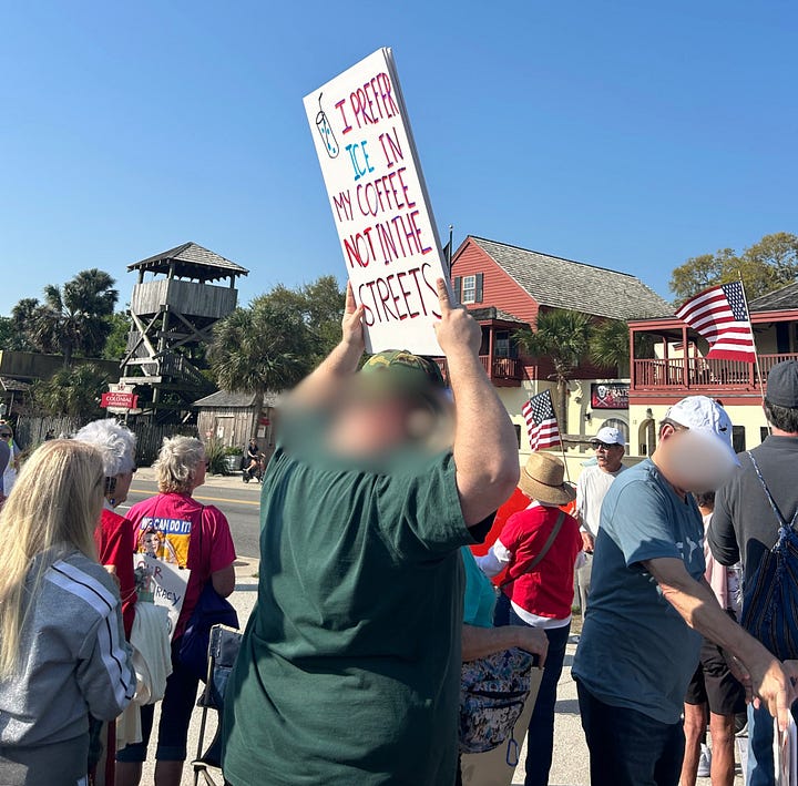 Clockwise from top left: two protesters hold a sign that reads "America, Stop Putting Corporations First." The stop is a stop sign; A protester in a white tiger t-shirt holds a sign that says "Make Orwell Fiction Again"; a protester with their back to us holds a sign that reads "I prefer ICE in my coffee," not in the streets." a woman in a white baseball hat, a skirt and red shoes holds a sign that reads "War! What Is It Good For? Distracting from The Epstein Files. (Sing It Again!).