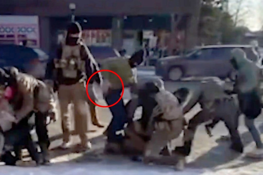 A federal agent drawing his gun before shooting Pretti. A federal agent drawing his gun before shooting Pretti.