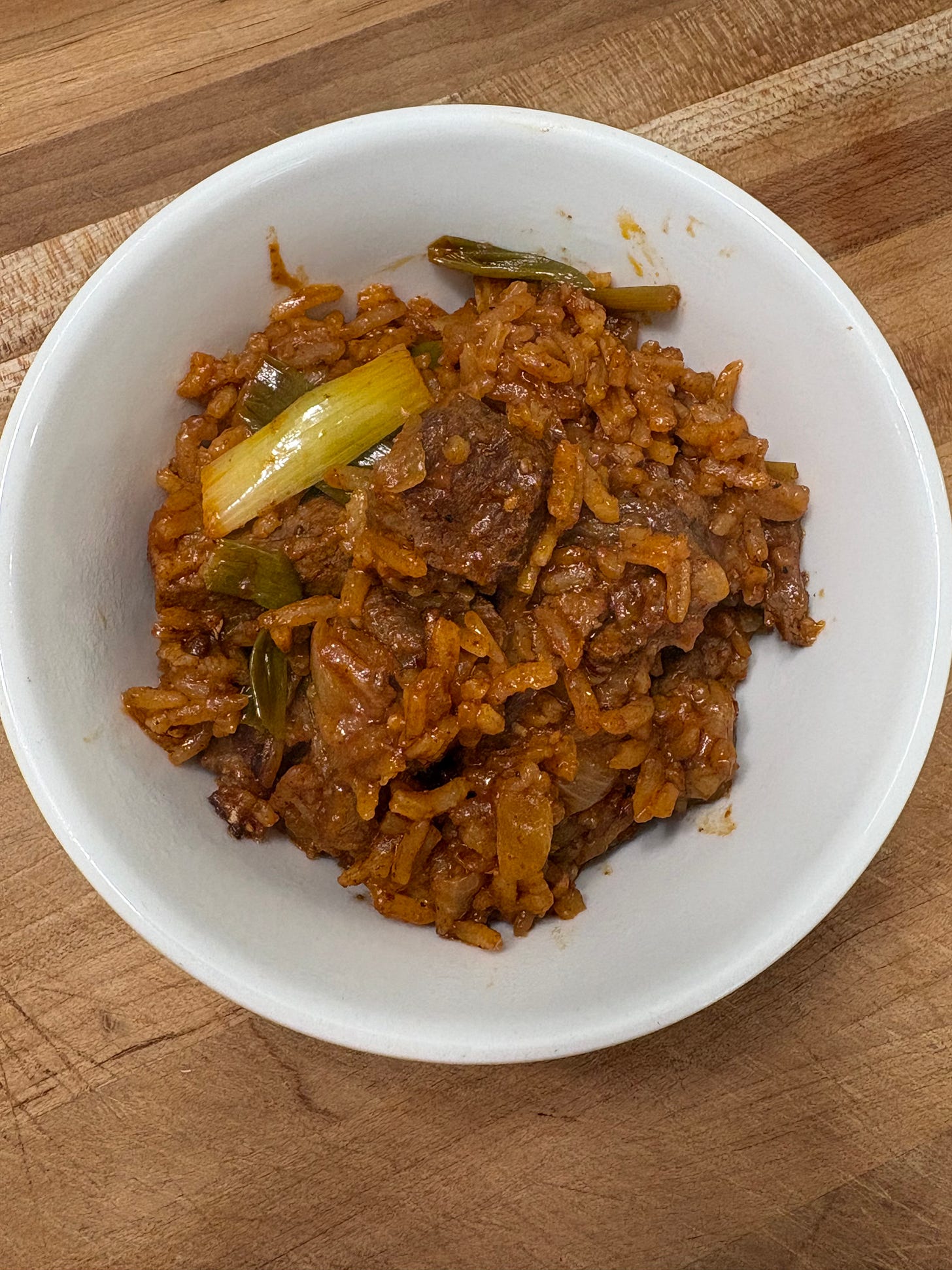 The finished rice dish in a small white bowl