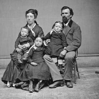 Studio portrait of Leroy Gates and family. Studio portrait of Leroy Gates and family.