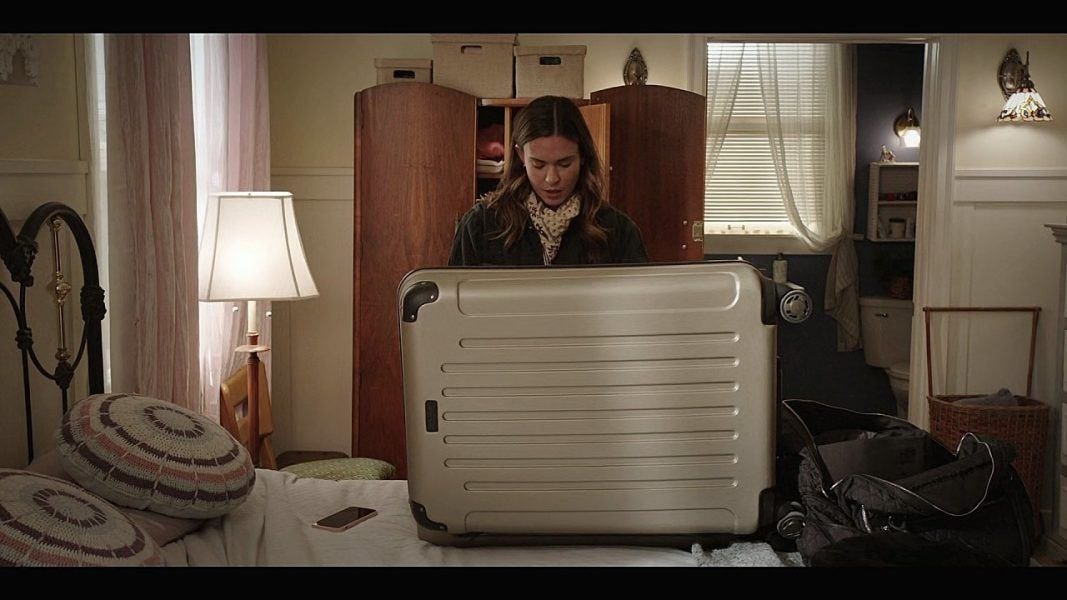 Walker Geri with open metal suitcase. Walker Geri with open metal suitcase.