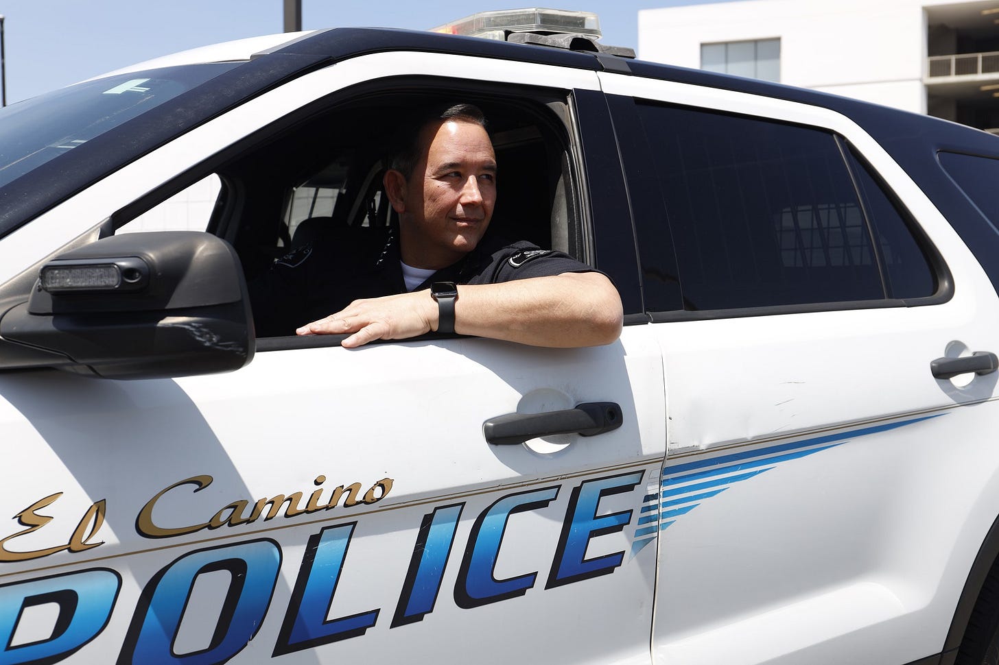 Chief of Police Matthew Vander Horck glances out the window in a patrol vehicle at El Camino College Police Department's back lot Tuesday, April 22. Vander Horck is the department's 10th full-time chief, succeeding Michael Trevis who served at the college for 16 years. (Greg Fontanilla | Warrior Life)