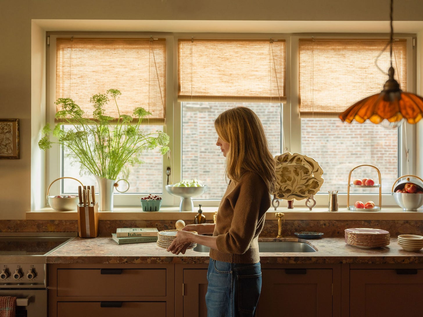 Amanda Brooks in her kitchen which was designed and crafted by Plain English.