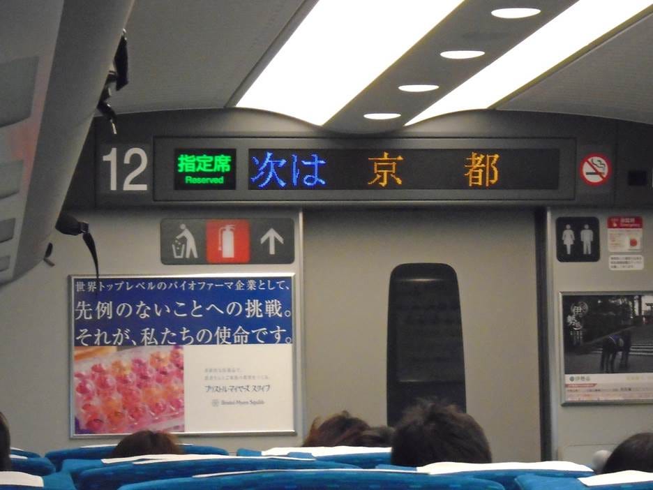 A group of people sitting in a bus

AI-generated content may be incorrect.
