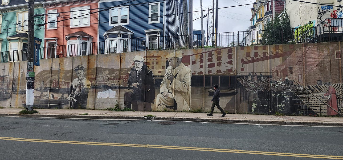 May be an image of 3 people and street