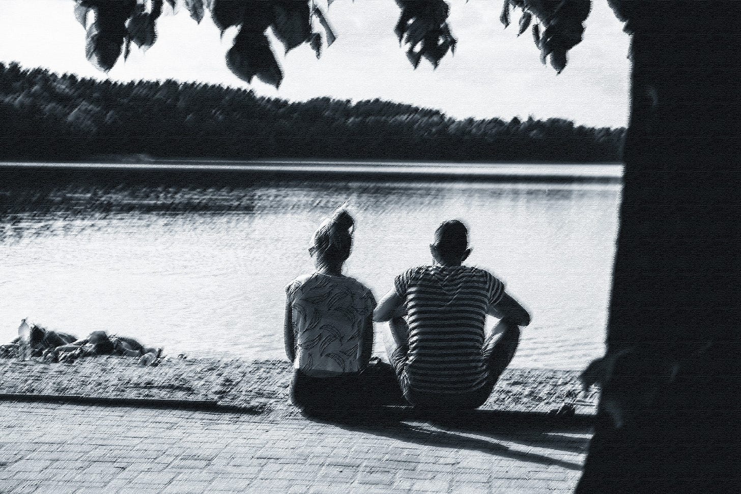 Couple sitting at lake Couple sitting at lake