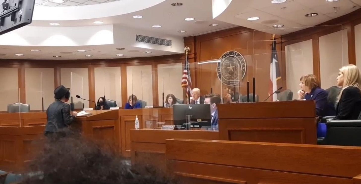 Lyric on the stand, giving testimony, in one of the meetings at the Texas Capital on ABA.
