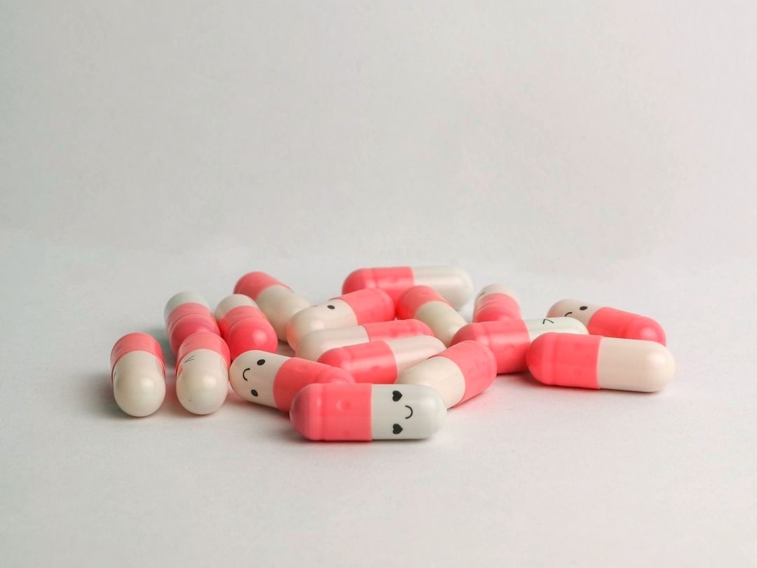 pink and white medication pill