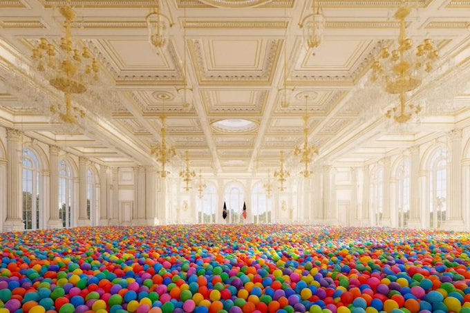 Grand ballroom with ornate white and gold walls crystal chandeliers arched windows and a central dome filled entirely with a sea of colorful plastic balls in reds blues greens yellows and other hues creating a playful overflowing effect from floor to ceiling.