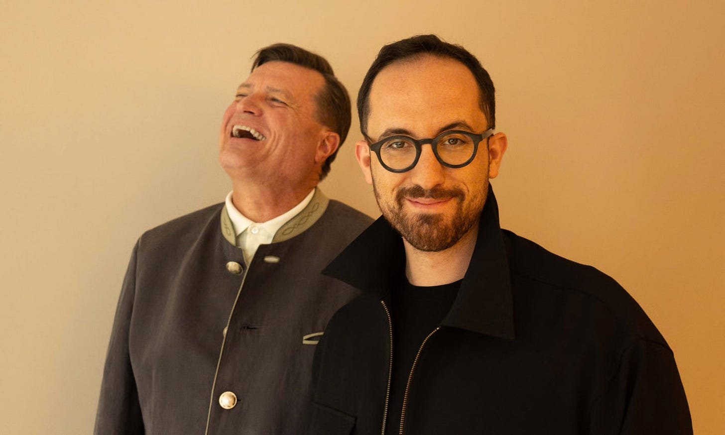 Christian Thielemann throws his head back in laughter as Igor Levit looks quizzically into the camera