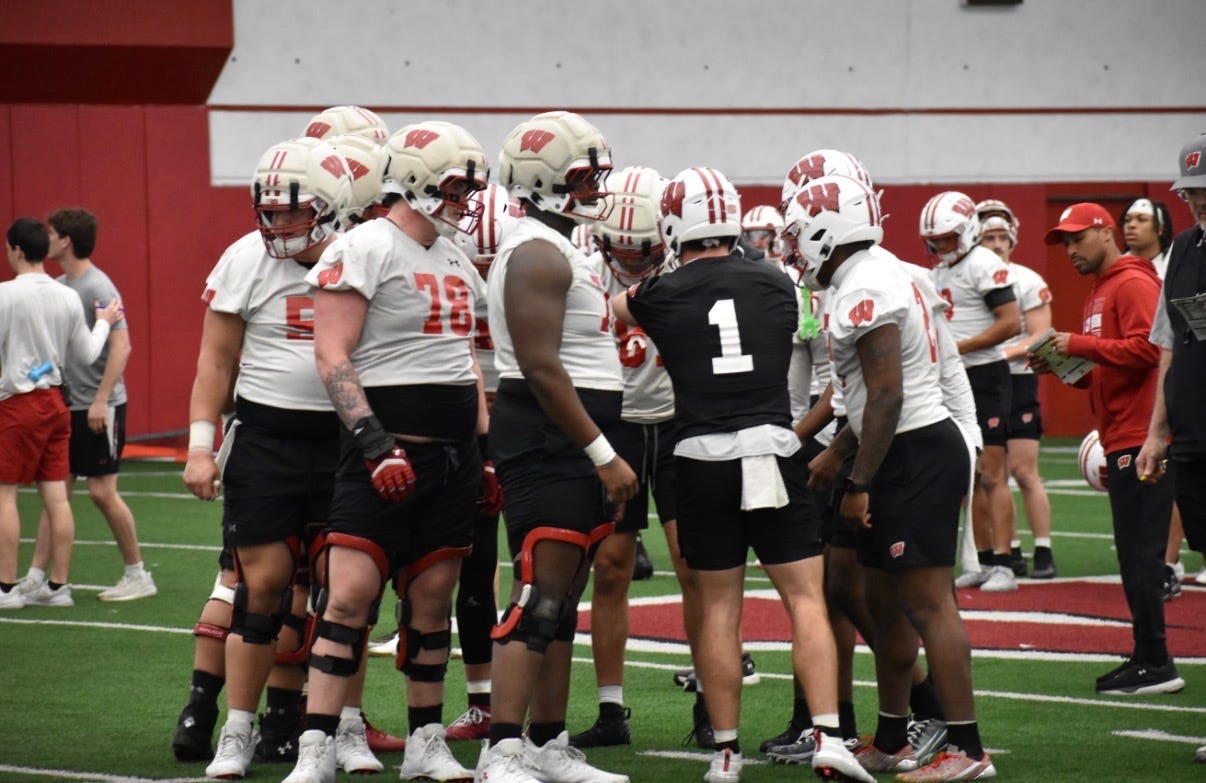 Wisconsin Badgers quarterback Colton Joseph gathers with the offense during a spring practice session Wisconsin Badgers quarterback Colton Joseph gathers with the offense during a spring practice session