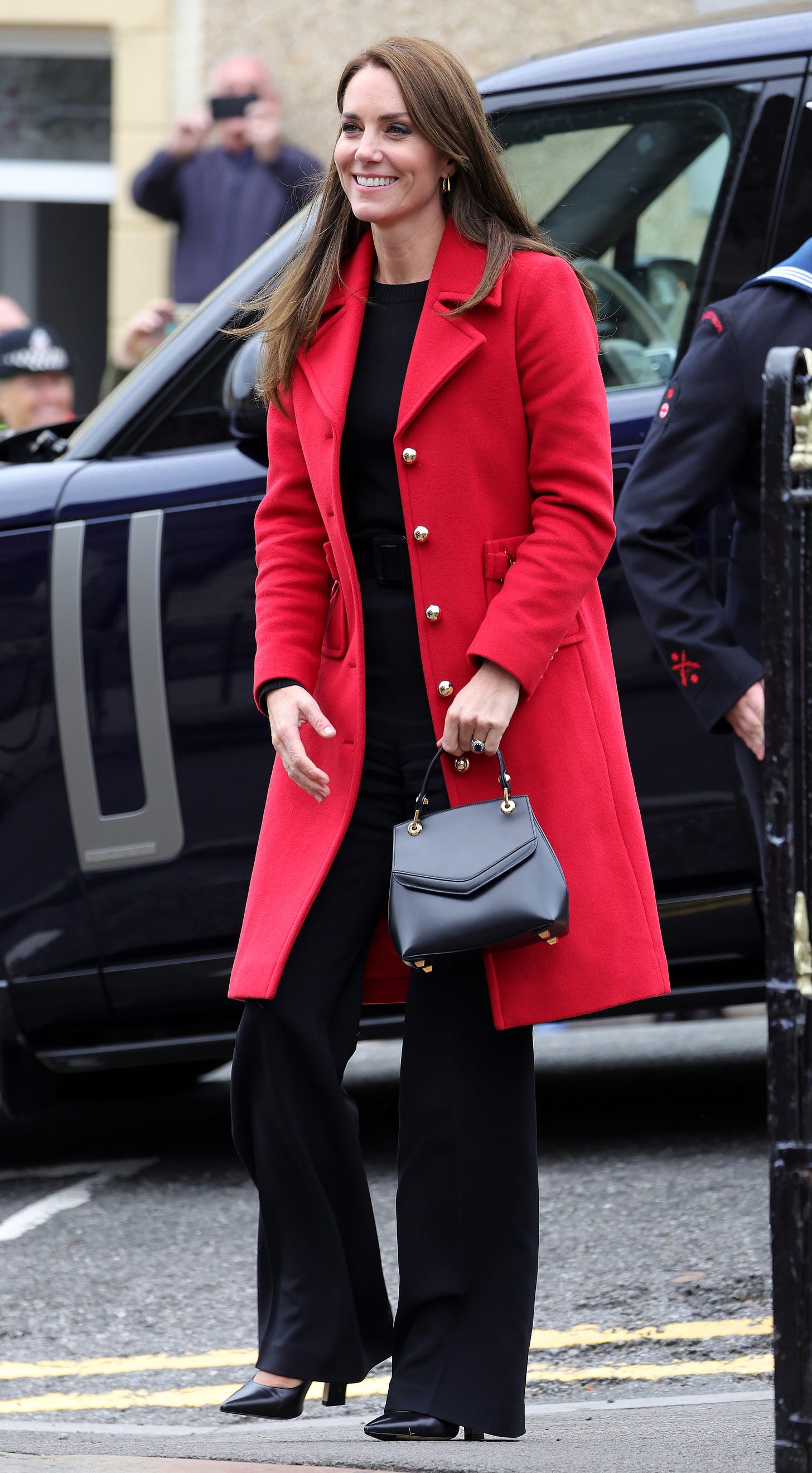 Princess Kate in a red coat carrying her £2,730 Grace Han handbag