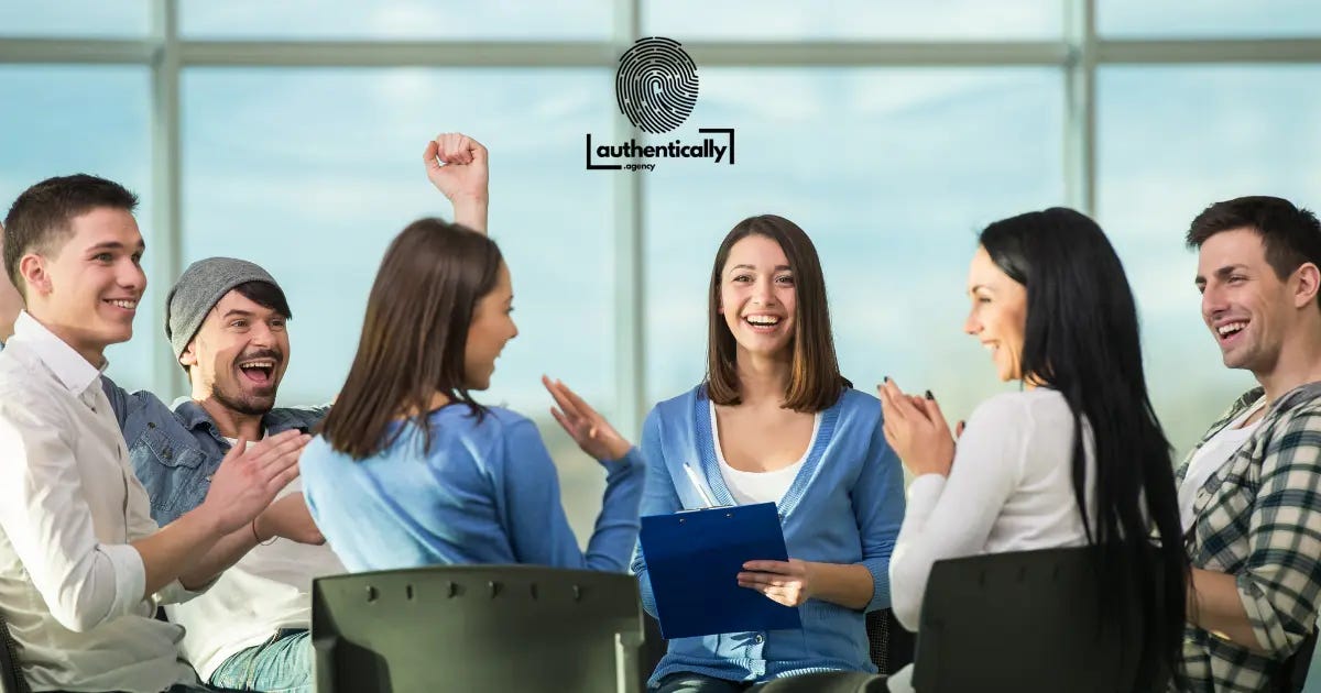 Group of younger people sitting around discussing an issue - smiling